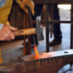 Hammering hot steel